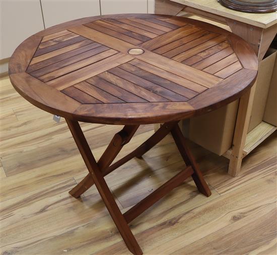 A teak folding garden table Diameter 90cm